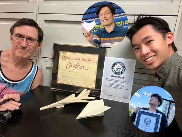 Julian Chee Yie Jian (right) with 1985 'farthest flight of a paper aircraft' record holder James Zongker (left) and their paper plane designs.