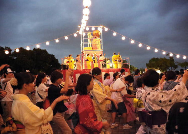 Women dance during the Minato Mirai Bon Odori festival in Yokohama, Japan.