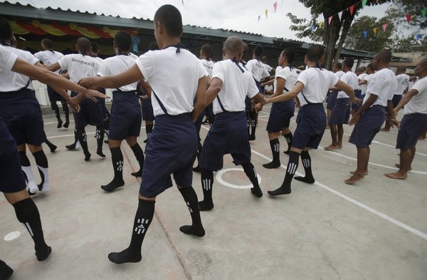 Thai inmates taking part in exercise in prison. Human rights activist groups push for rehabilitation of inmates, not harsh punishments.