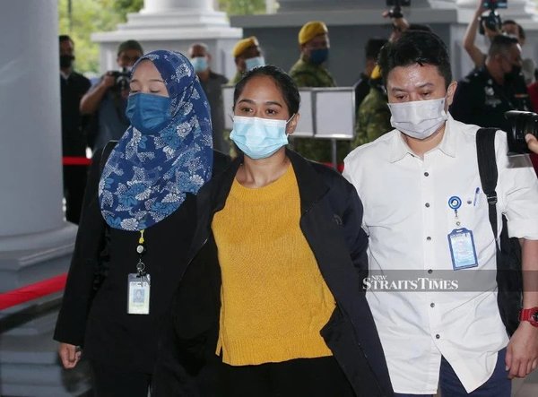 Accused, Siti Nuramira Abdullah, arriving at the Kuala Lumpur Court Complex on 13 July.