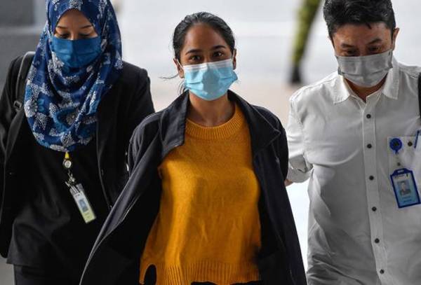 The accused, Siti Nuramira Abdullah, arriving at the Kuala Lumpur Court Complex on 13 July.