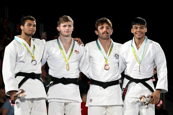 Birmingham 2022 Commonwealth Games under 73kg weight class judo medallists from left to right: Faye Njie of Gambia, Daniel Powell of England, Jake Bensted of Australia, and Amir Daniel.