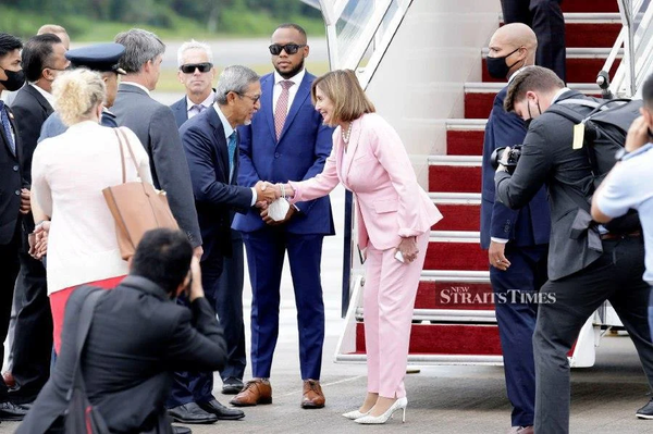 Pelosi shaking hands with Dewan Rakyat Deputy Speaker Datuk Mohd Rashid Hasnon.