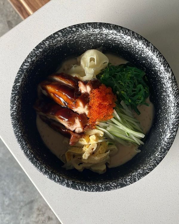 Cold Soba, a noodle dish served with seaweed chicken slices, Japanese Kyuri, and tamago with sesame sauce.