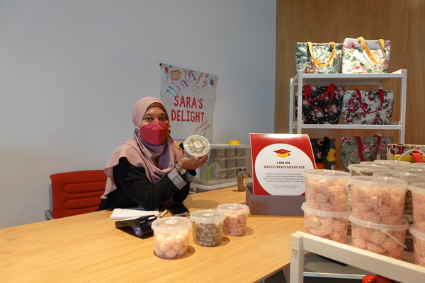 Afifah with her products at the YOUths Pocket Summit.