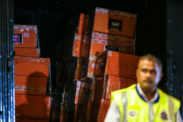 One of the police trucks loaded with boxes parked at the lobby of the Pavilion Residents, where Najib and Rosmah reside.