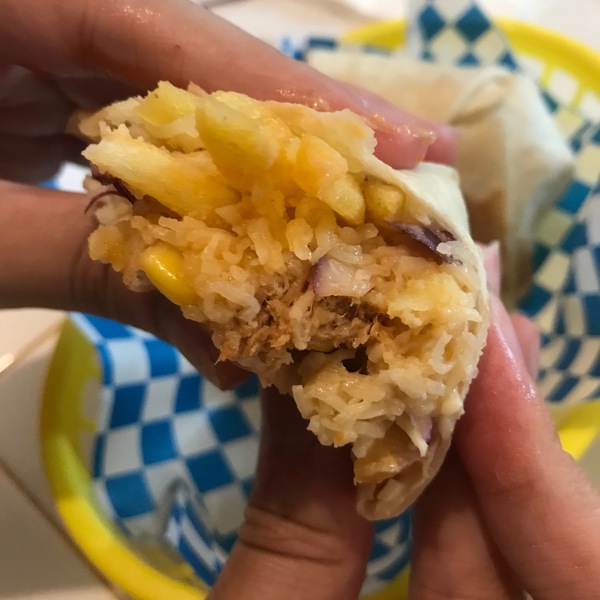 A bite into the contents of the burrito.