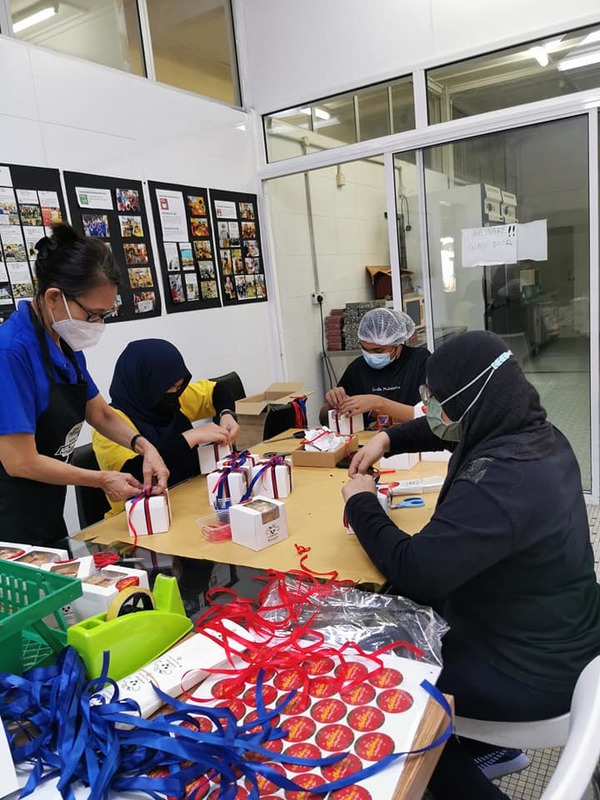 The Silent Teddies team busy packaging orders.