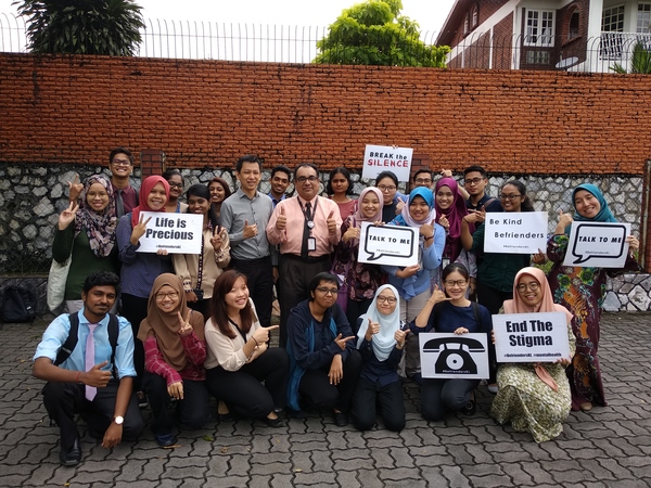 Lim posing for a photograph with other fellow advocates who want to bring an end to the stigma surrounding suicide.