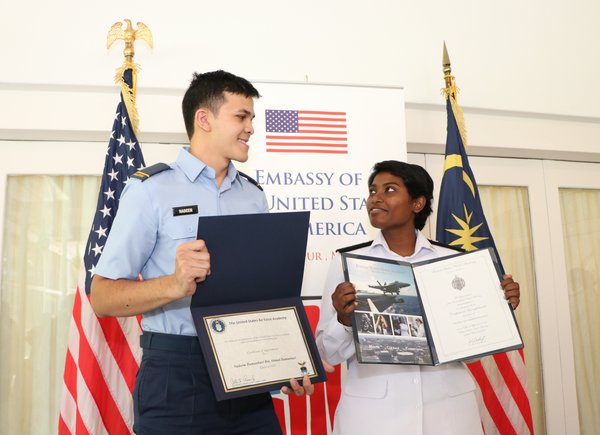 Janushaa (right) pictured alongside fellow Malaysian Putra Nadeem at their induction ceremony.