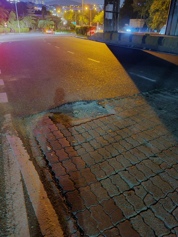 The pothole that had caused the incident.