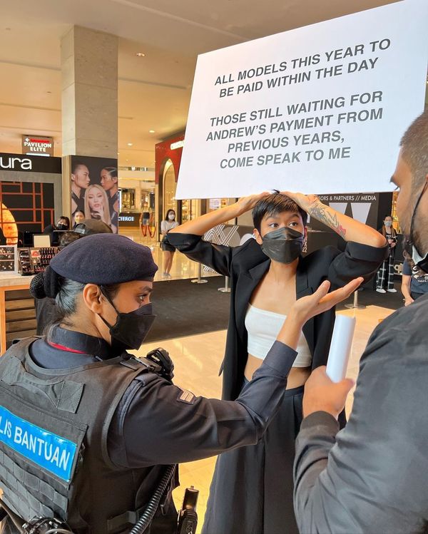 Alicia being confronted by security during the protest.