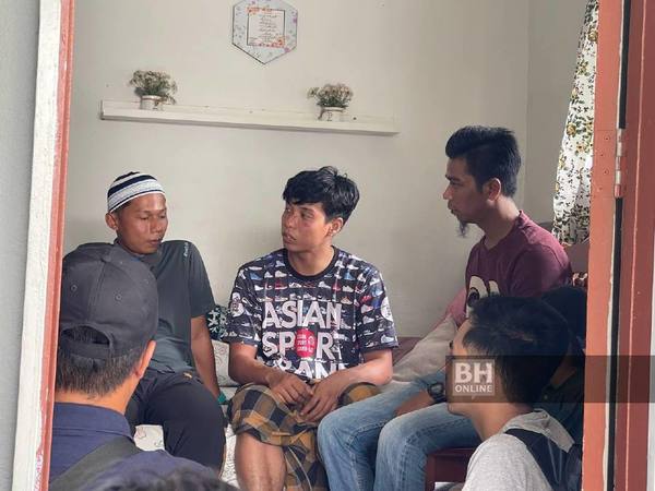 Redzuan Jamil (centre), when met at his home in Kota Tinggi, Johor, on Sunday, 16 October.