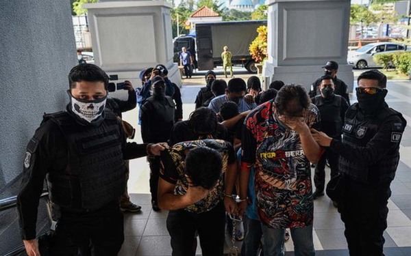 Photos showing 11 individuals, who are accused of being Mossad agents, at the Kuala Lumpur Magistrate's Court.