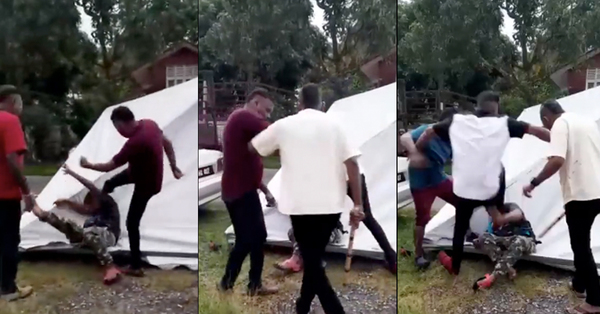 Screenshot from the viral videos showing the group of men assaulting the victim, who lays motionless on the ground.