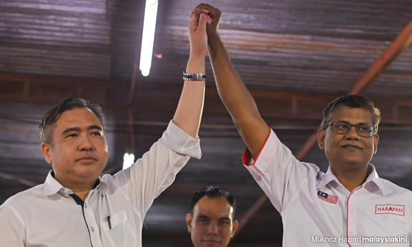 Photo of DAP secretary-general Anthony Loke and Kota Kemuning assemblyperson V Ganabatirau.