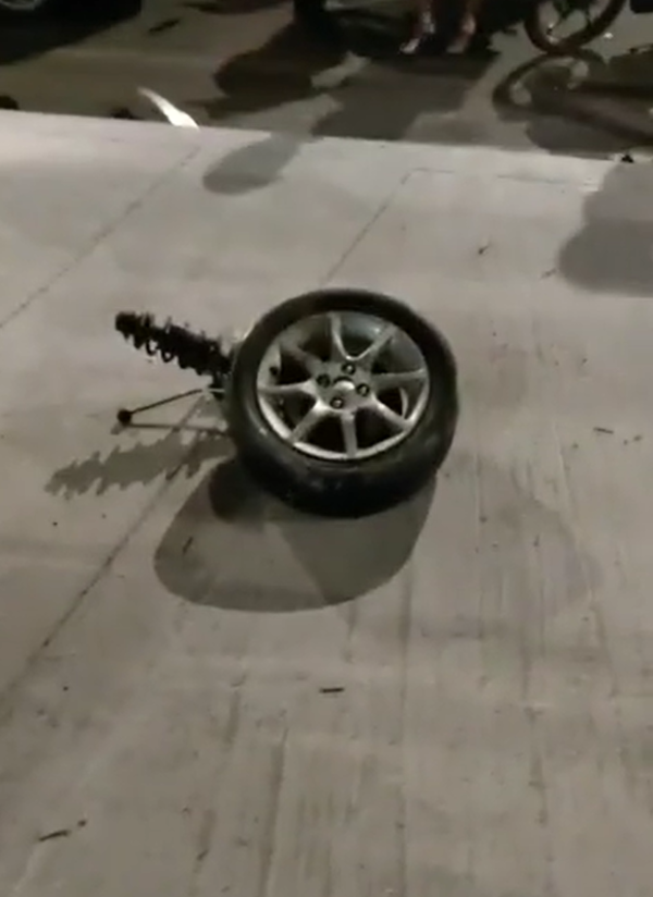 The tire got unplugged from the car due to the horrific accident.