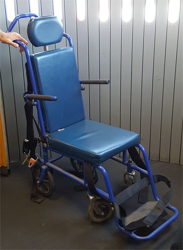 A typical aisle wheelchair used on airplanes to transport disabled passengers during boarding and disembarking.