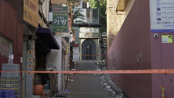 Photo of the empty narrow, sloping alley that was packed with people on the night of the tragedy.