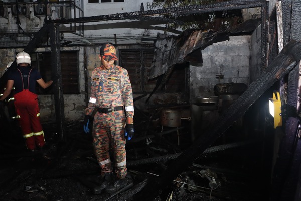 Firefighters surveying the damage of the site.