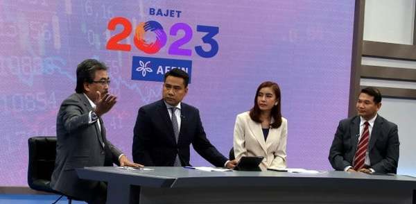 Datuk Seri Johari Abdul Ghani (left) discussing on a televised programme how the inconsistent lockdown measures hampered economic growth.