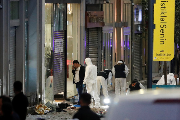 Police members work at the scene after an explosion in busy pedestrian Istiklal Street in Istanbul, Turkey.