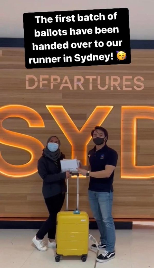 A runner from Malaysian Students' Council of Australia (MASCA) collecting ballots before flying back to Kuala Lumpur.