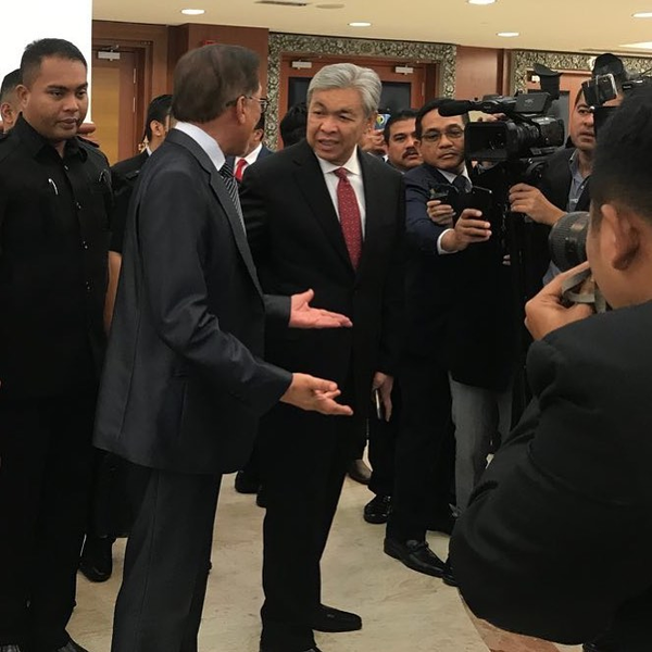 Datuk Seri Anwar Ibrahim and Zahid photographed together outside of Dewan Rakyat in 2018.