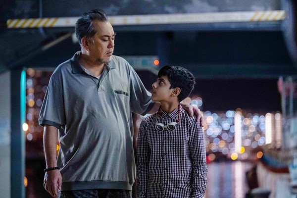 A Pakistani refugee boy, played by Sahal Zaman, and a grumpy local taxi driver, played by Anthony Wong.