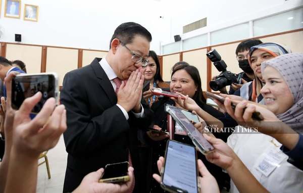 DAP chairman Lim Guan Eng gestures while answering questions posed by the media.