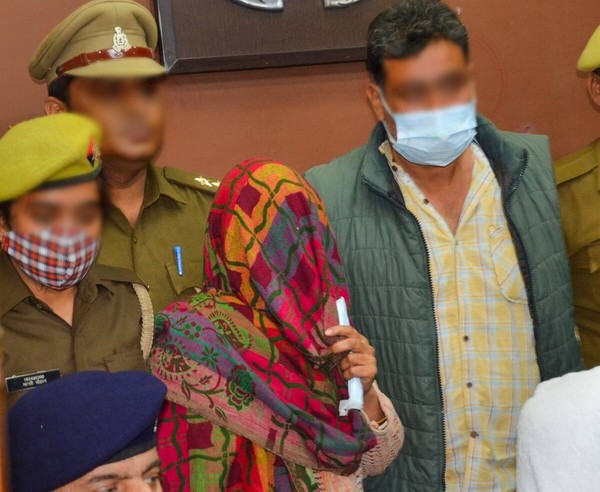 Aayushi's parents in court during her murder case in Mathura, Uttar Pradesh, India.