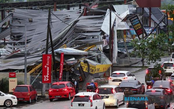 Roofs on houses and shops were destroyed due to the freak storm in Kampung Pasir yesterday.