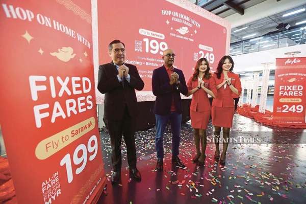 Transport Minister Anthony Loke (left) and AirAsia Aviation Group Ltd group chief executive officer Bo Lingam (second from left).