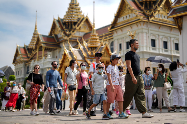 Tourists wait to check in for flights, ahead of an influx of Chinese tourists as COVID-19 restrictions are dismantled, at Bangkok's Suvarnabhumi airport, Thailand.