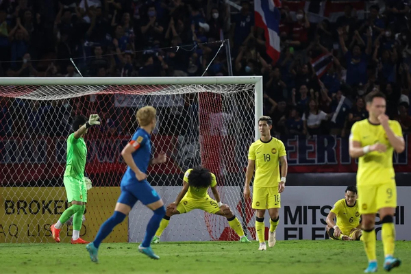 A Harimau Malaya player's disappointed reaction after conceding defeat to Thailand.