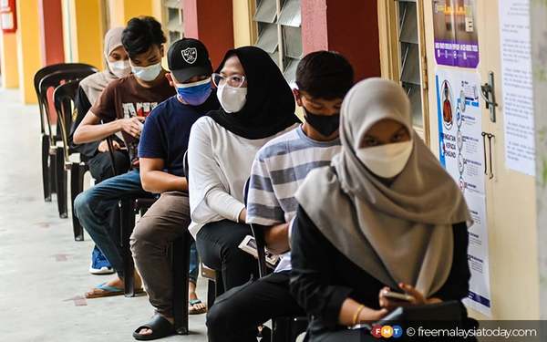 First-time voters waiting for their turn to vote.