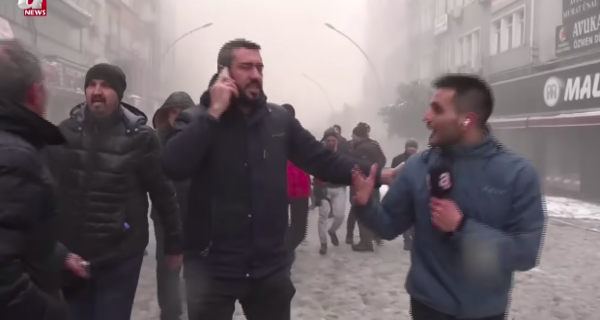 Akalan (right) walking through Malatya, Turkiye, moments before the second earthquake hit.