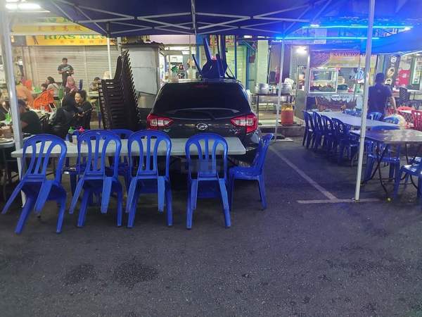 A chair perched on the roof of the Myvi.