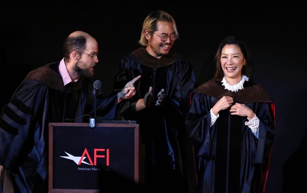 Yeoh with Scheinert (left) and Kwan (middle) at the Chinese Theatre in Hollywood, California, where Yeoh received an honorary Doctorate of Fine Arts by the American Film Institute (AFI).