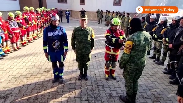 The Mexican military paying homage to their fallen canine comrade.