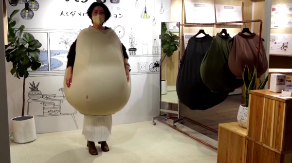 A woman displaying the wearable beanbag.