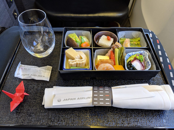 A photo of a non-vegan meal served on Japan Airlines.