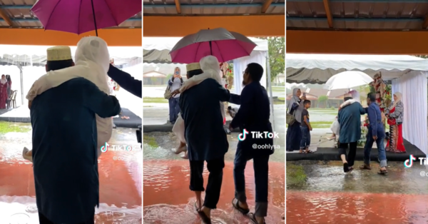 Screen grab from the TikTok of the bride being carried across the flood water.