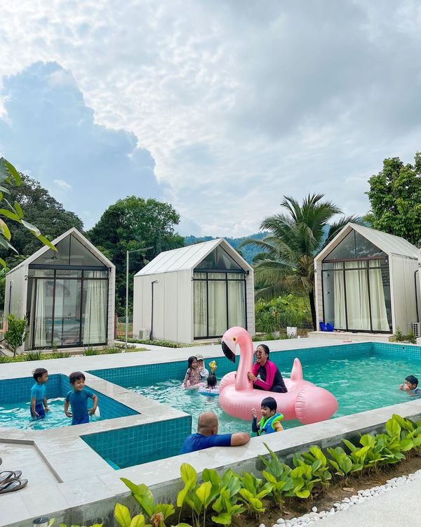 Patrons in the swimming pool at Casa Menanti.