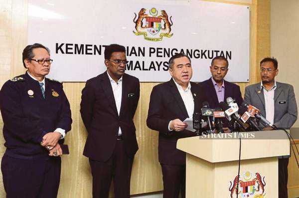 Transport Minister Anthony Loke (third from left) announcing the abolishment of the theory test in Putrajaya.