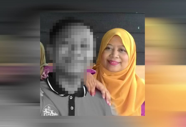 File photo of Fatimah Nasir with her son, Azrie.