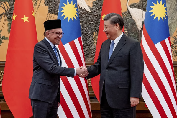 Anwar (left) shaking hands with Chinese President Xi Jinping during a meeting at the Great Hall of the People in Beijing last month.