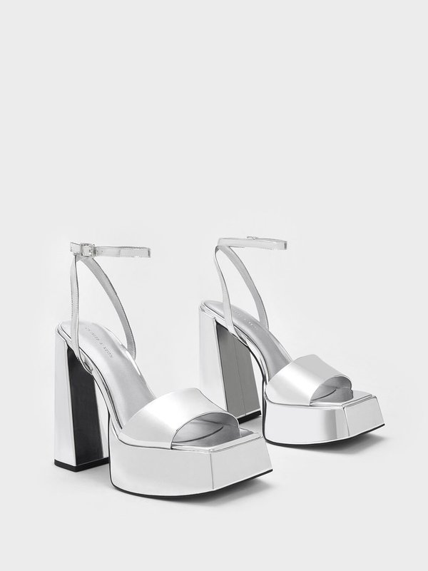 Charles & Keith's Ankle-Strap Platform Pumps in silver.