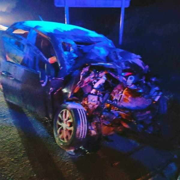 The condition of the car after it crashed into the lorry.