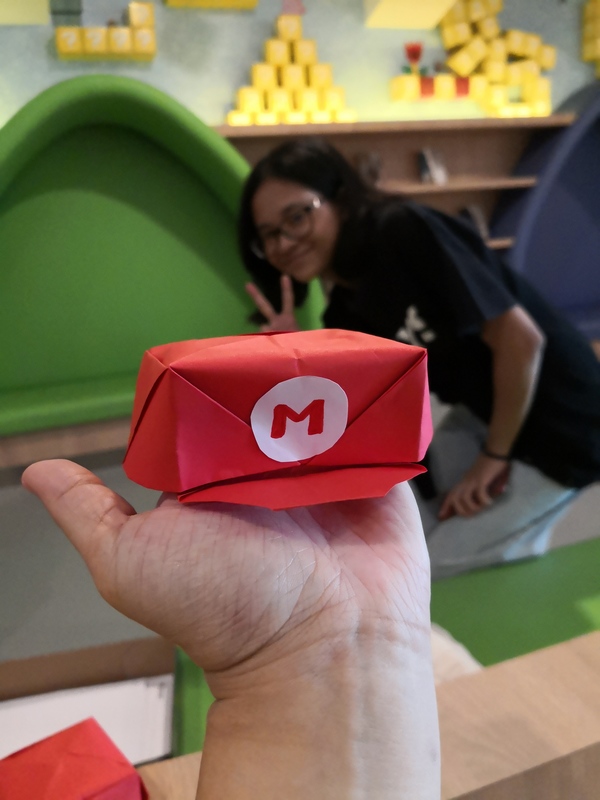 Look at that adorable little Mario hat! Awww. <3